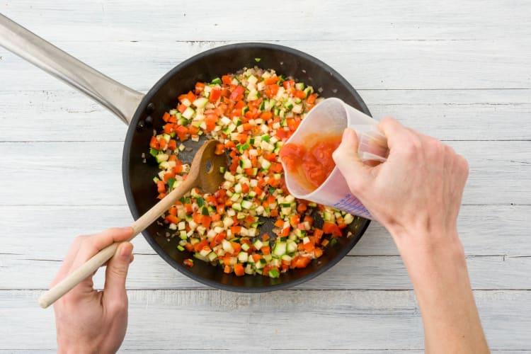 Add the diced tomatoes & water