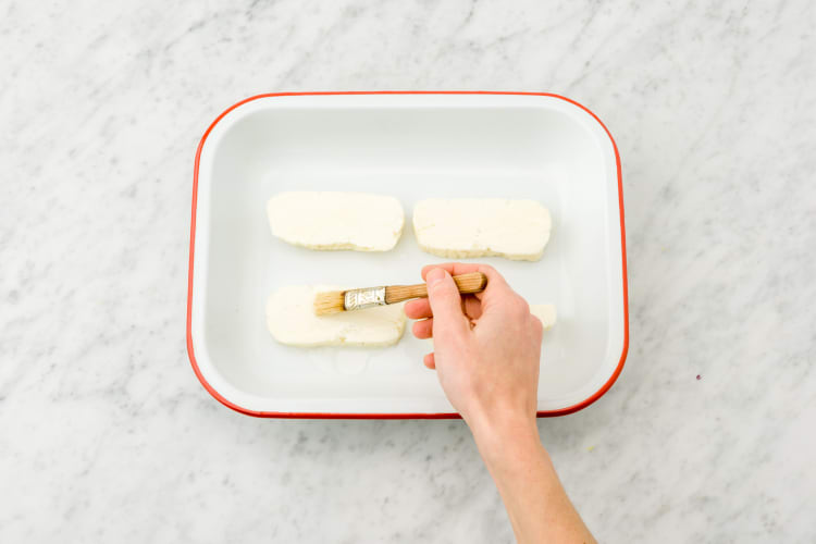 Brush both sides of the halloumi with olive oil