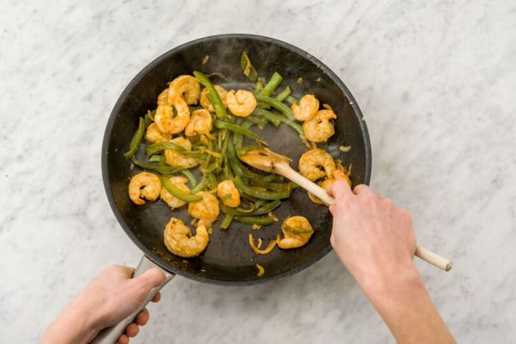 Cook shrimp and peppers
