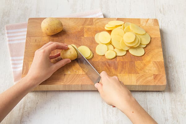 Very thinly slice the potatoes