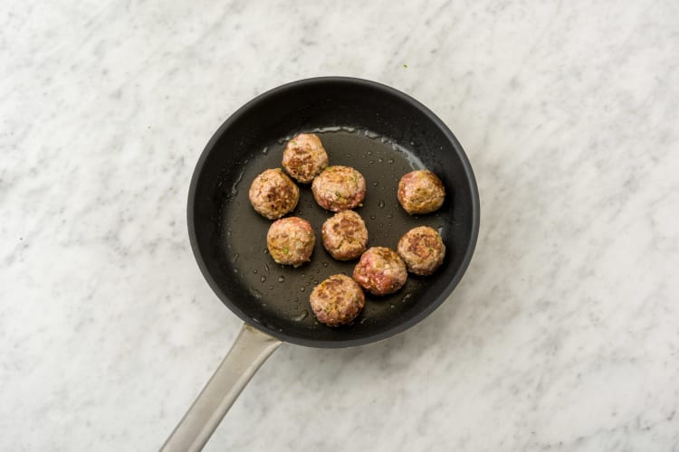 Cook the meatballs, turning occasionally