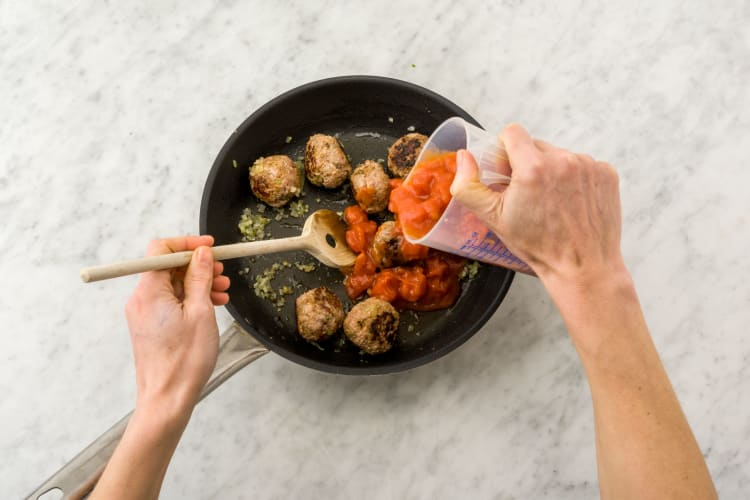 Return meatballs to the pan and cook sauce