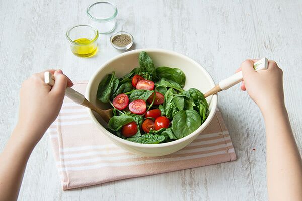 Make the spinach and tomato salad