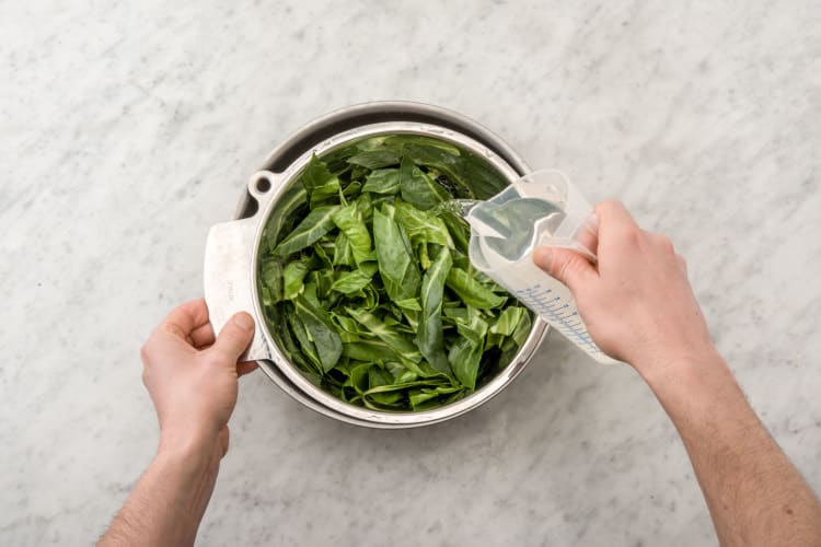 Rinse the spring greens