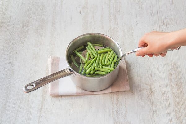 Cook the green beans and potatoes