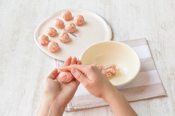 Form the meatballs and boil the pasta