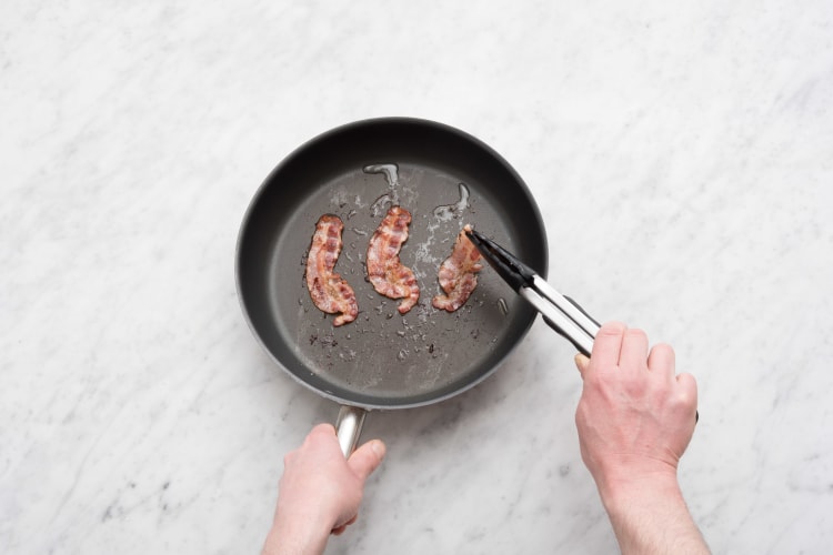Fry the bacon until crispy