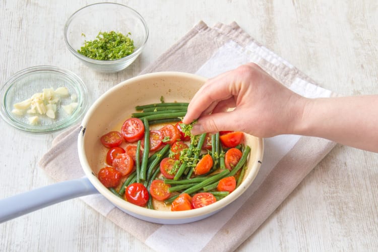 Sauté the tomatoes and green beans