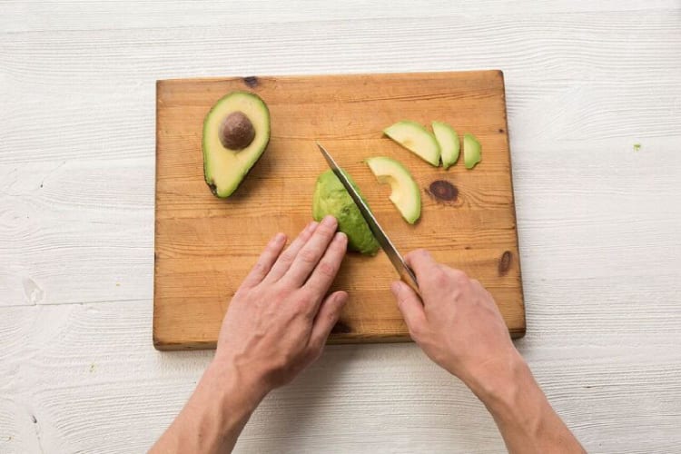 Halve, pit, and thinly slice the avocado