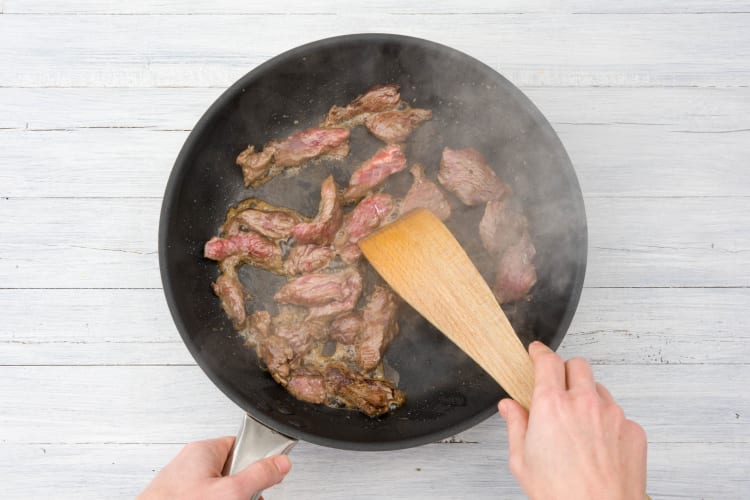Stir fry the beef strips
