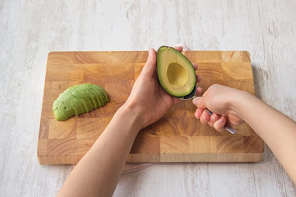 Halve and pit the avocado