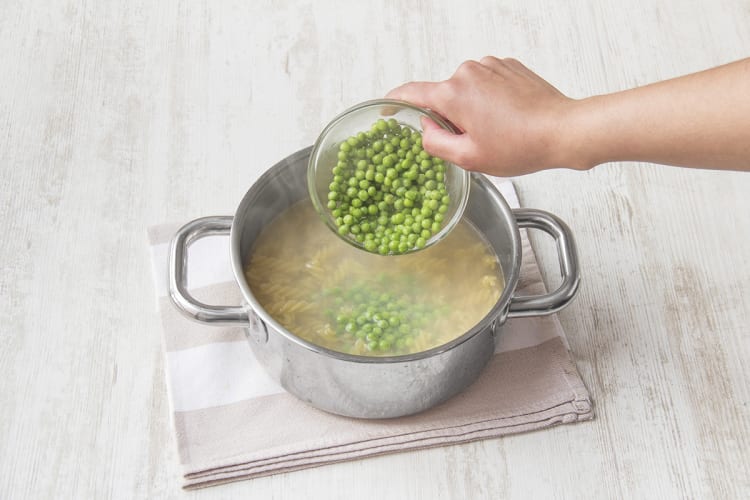 Add the peas to the pasta