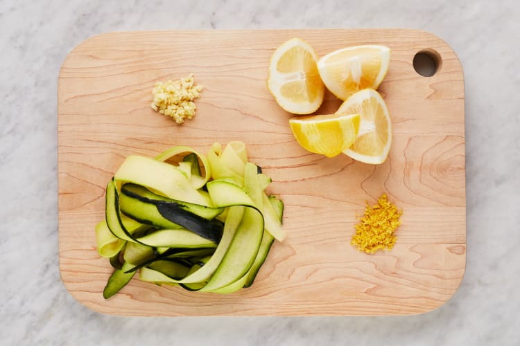 Premium Photo  Peeling fresh green zucchini with peeler. process