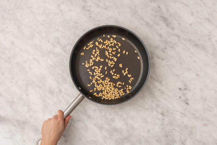 Toast the pine nuts