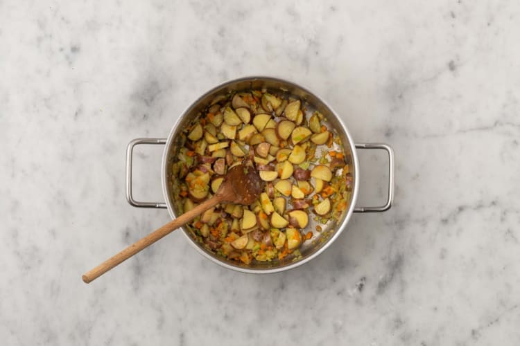 Cook potatoes and mirepoix