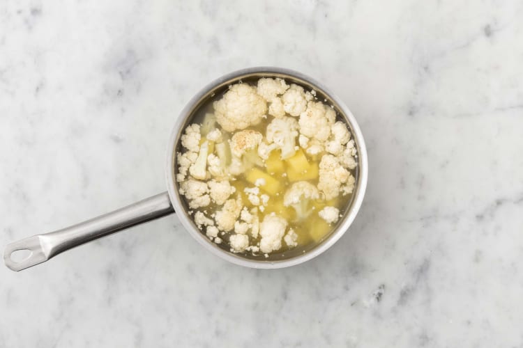 Cook potatoes and cauliflower