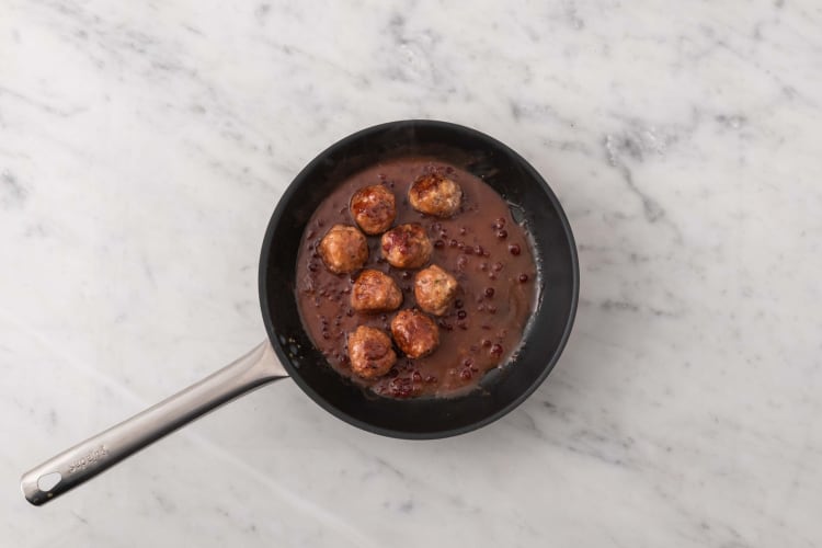 Mash sweet potatoes and glaze meatballs