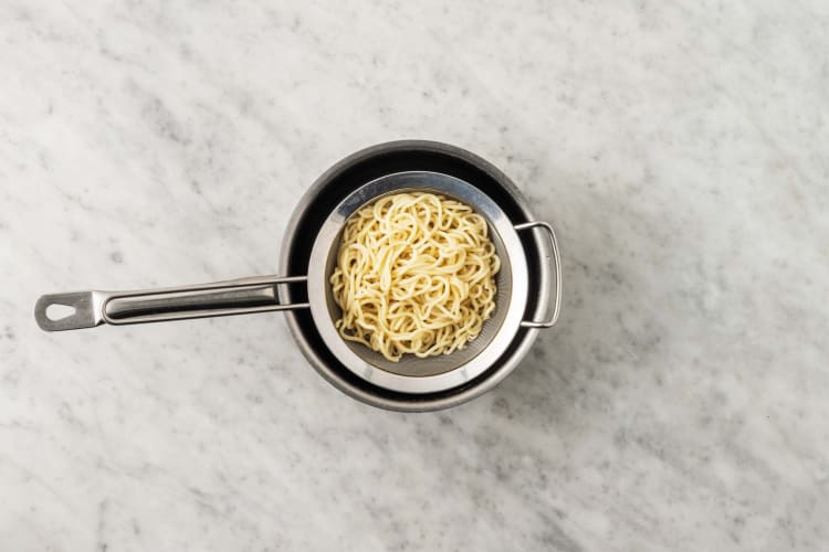 Cook noodles and make stir-fry sauce