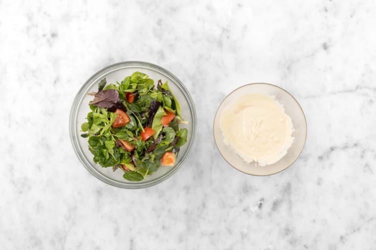 Make hummus dressing and salad