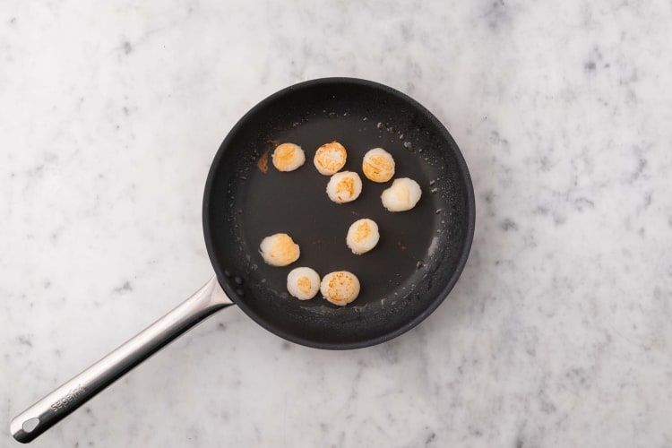 Cook scallops and shrimp