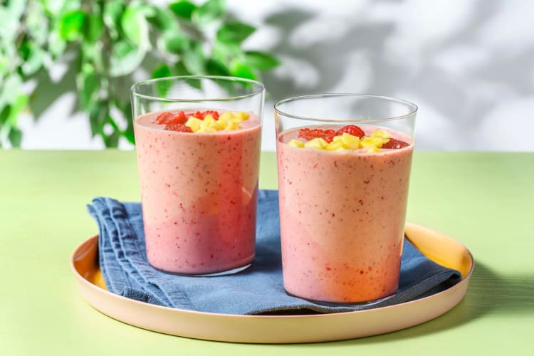 Tutti-frutti smoothie met frambozen met ananas, sinaasappel en banaan