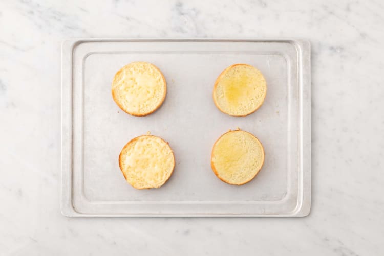 Cook patties and toast buns