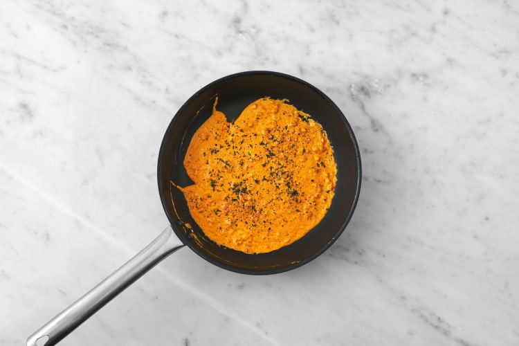 Make cheesy red pesto sauce