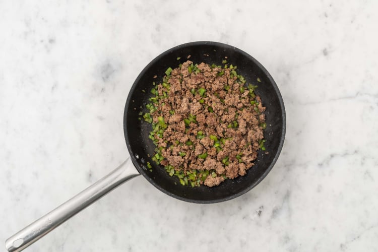 Cook beef and poblanos