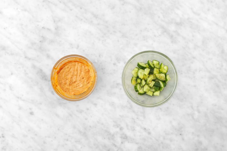 Marinate cucumbers and mix hummus