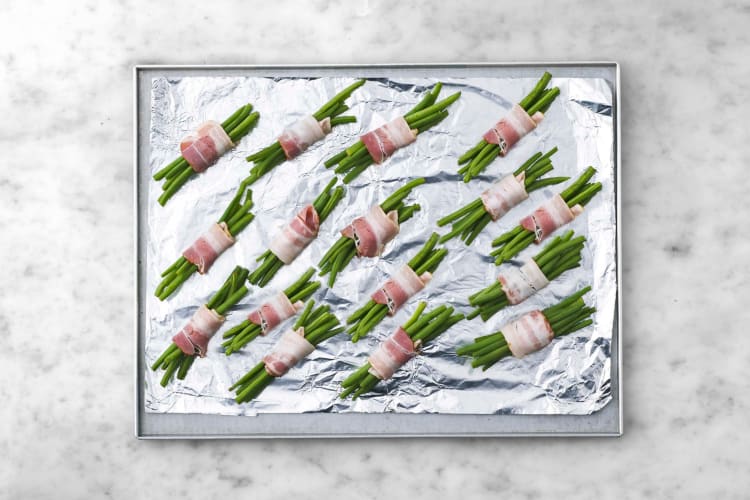 Wrap green beans with bacon