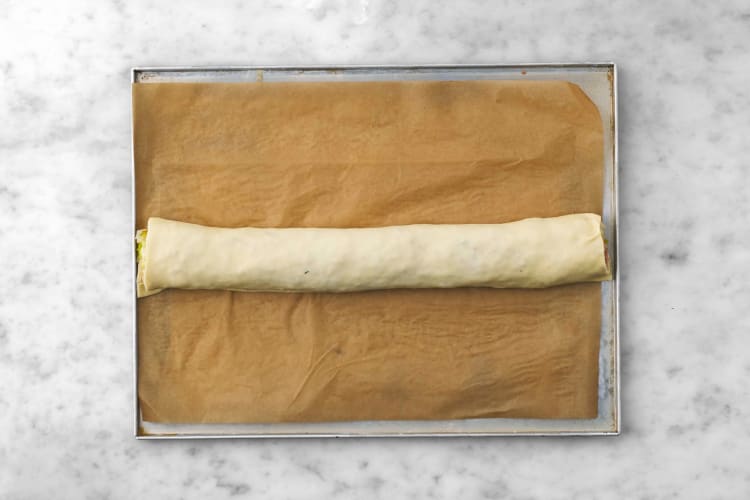 Re-stretch and roll dough 