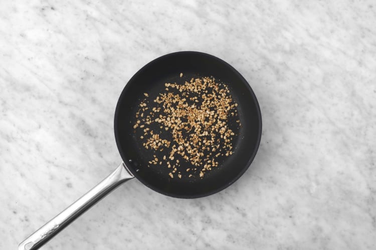 Toast pine nuts and prep