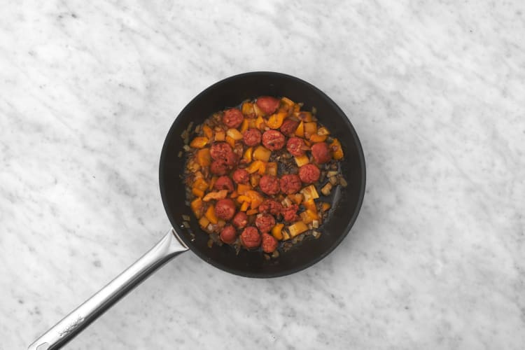 Cook chorizo and peppers