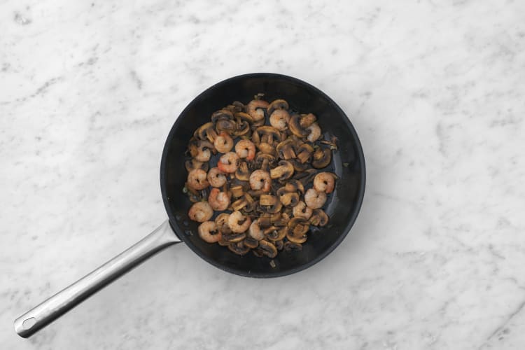 Cuocere funghi e mazzancolle