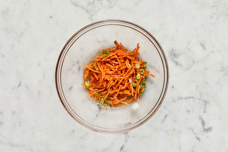 Cook zucchini and make carrot slaw