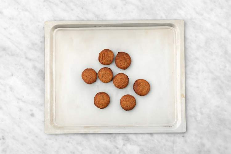 Cook chicken and roast falafel 