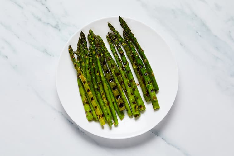 Grill asparagus and finish sweet potatoes