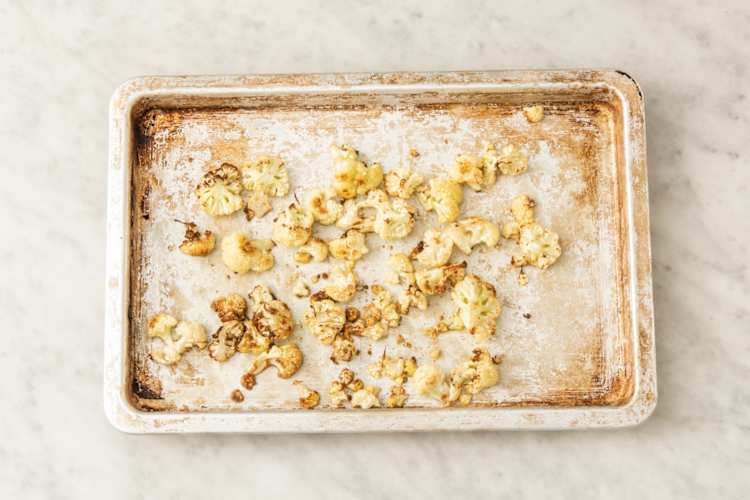 Roast cauliflower and cook chicken