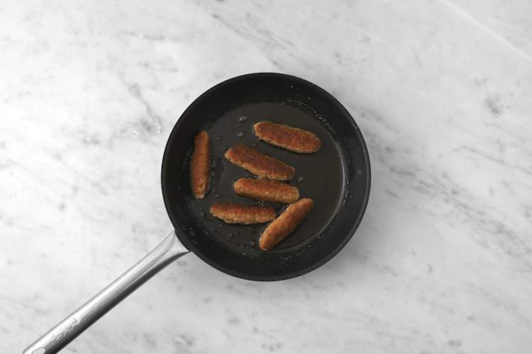 Cook the pork sausages