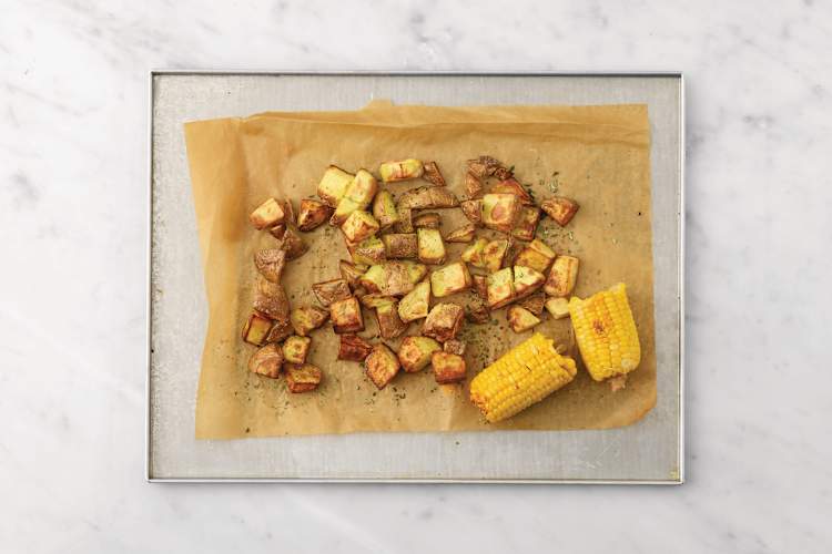 Roast the potatoes & corn