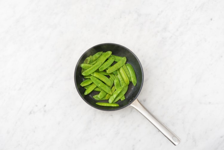 Glaze the chicken and cook the snap peas