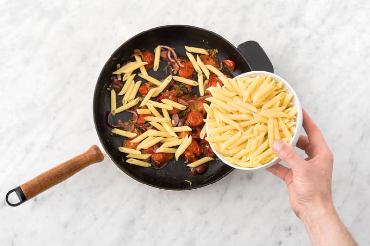 Toss the drained penne through the tomato mixture