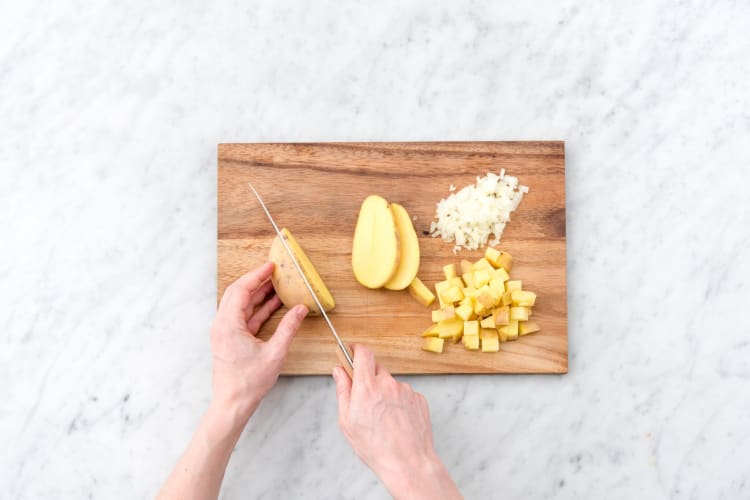 Prep the onion and potatoes