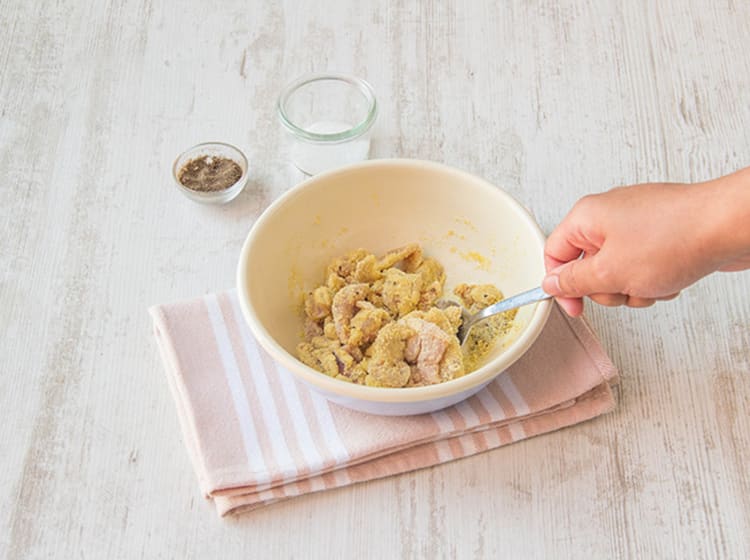 Toss pork with cornflour.