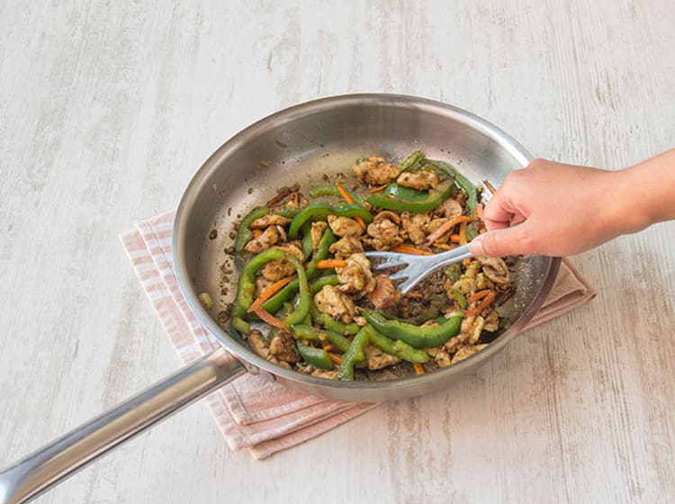 Cook veggies and pork.