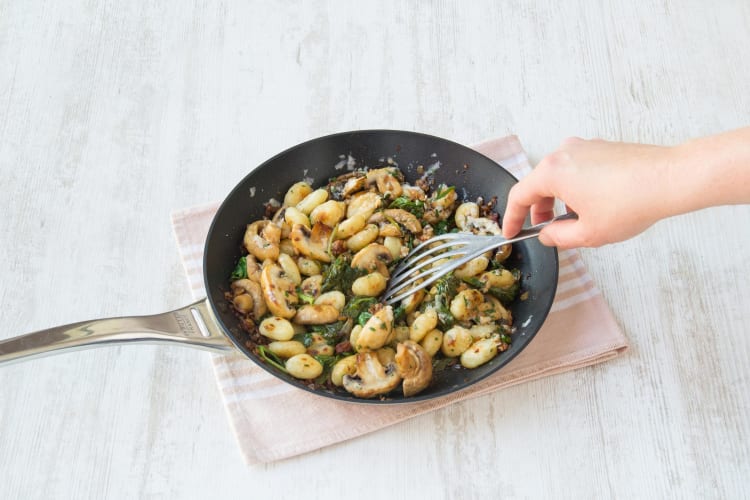 Stir through the parsley, Parmesan cheese, and baby spinach