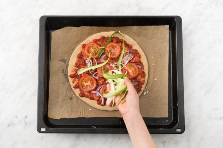 Top the pizza bases