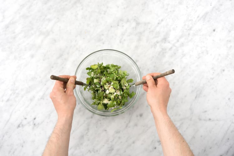 Toss the arugula with the dressing